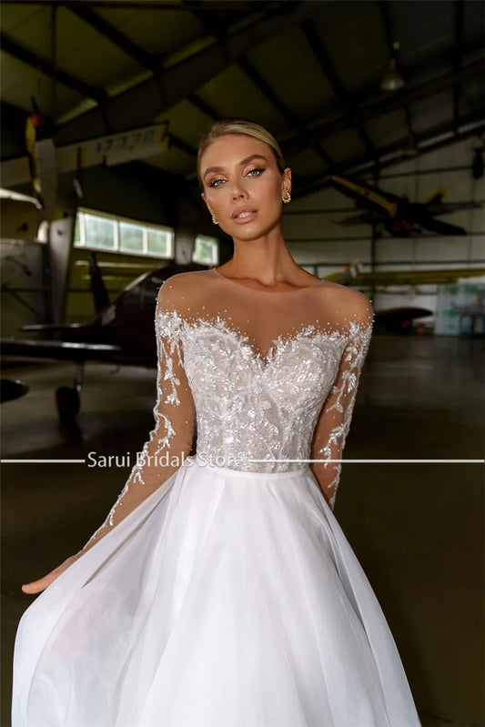 透明領口重水晶長袖白色婚紗/歐根紗和薄紗 A 字型閃亮新娘禮服